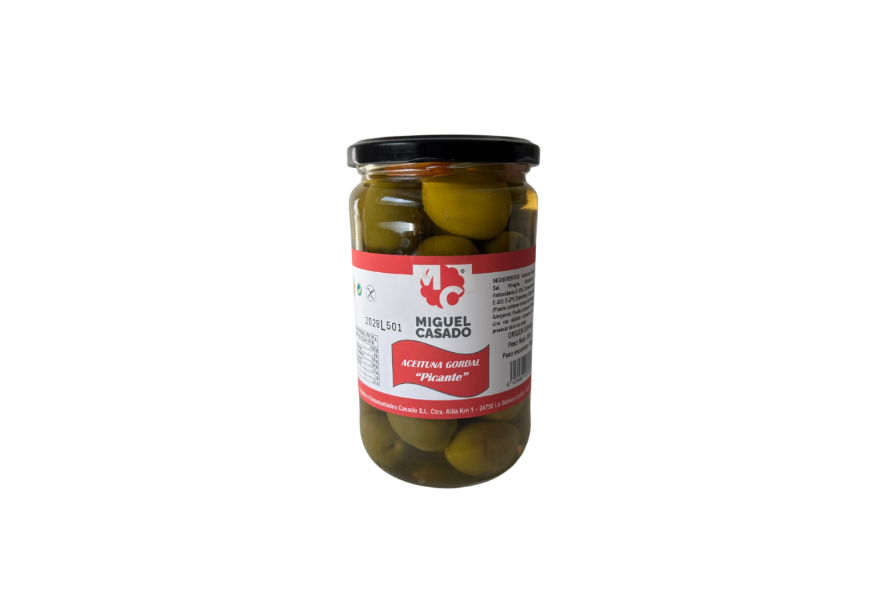 Măsline verzi Gordal picante într-un borcan de sticlă de 300 gr marca Miguel Casado, cu etichetă roșie și capac negru.