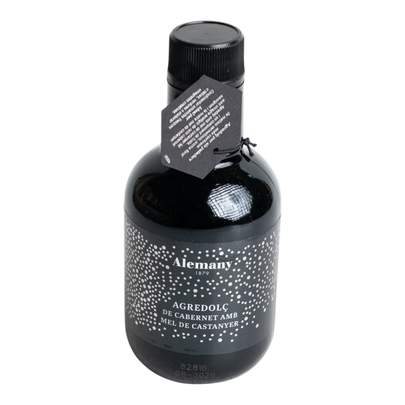 Sticlă de 250 ml cu oțet dulce-acrișor din vin Cabernet Sauvignon și miere de castan, din gama gourmet Alemany, cu etichetă neagră elegantă decorată cu puncte albe și etichetă suspendată crem. Ambalaj premium din sticlă.